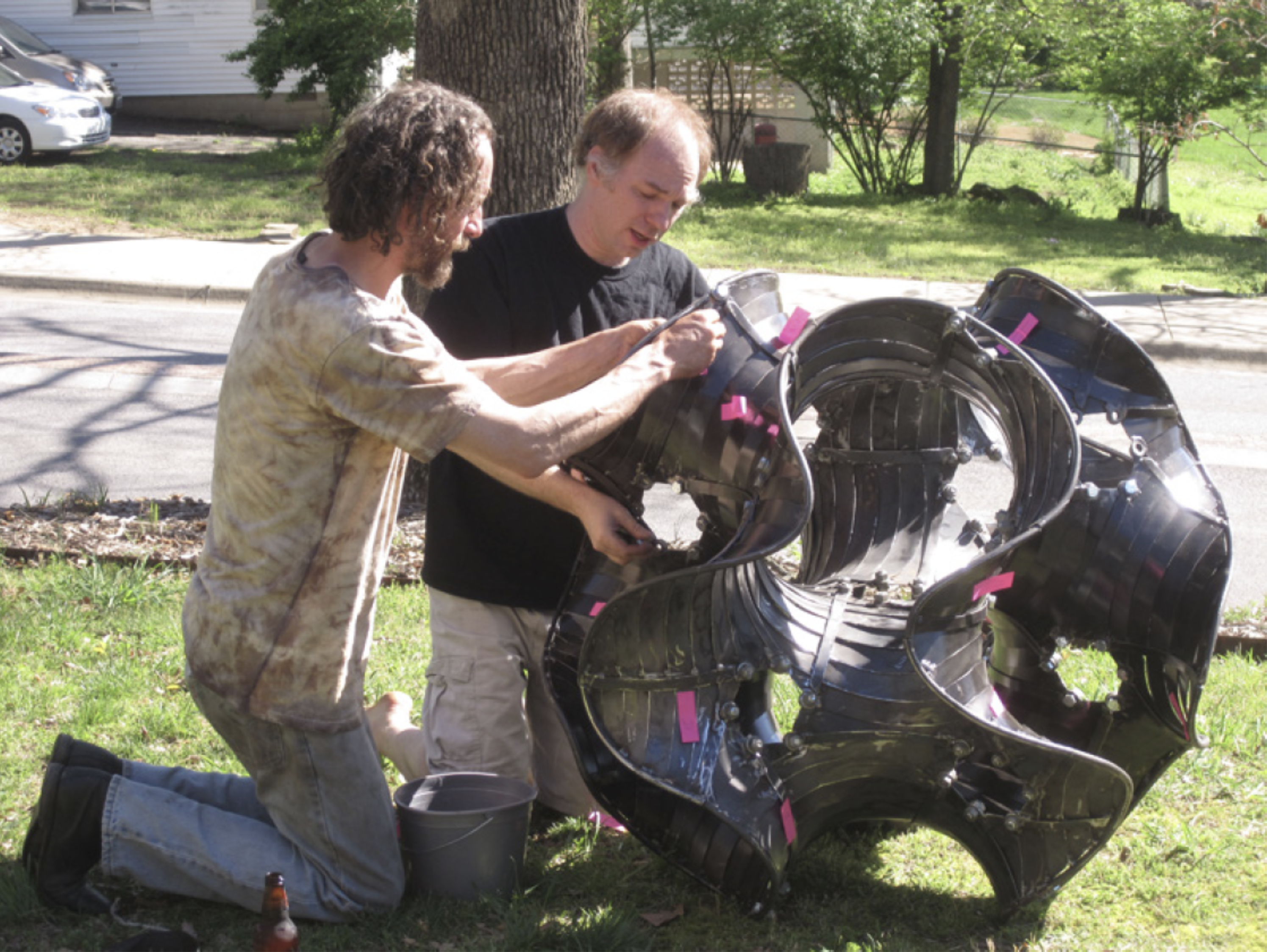 Chaim Goodman-Strauss working on a sculpture with a colleague