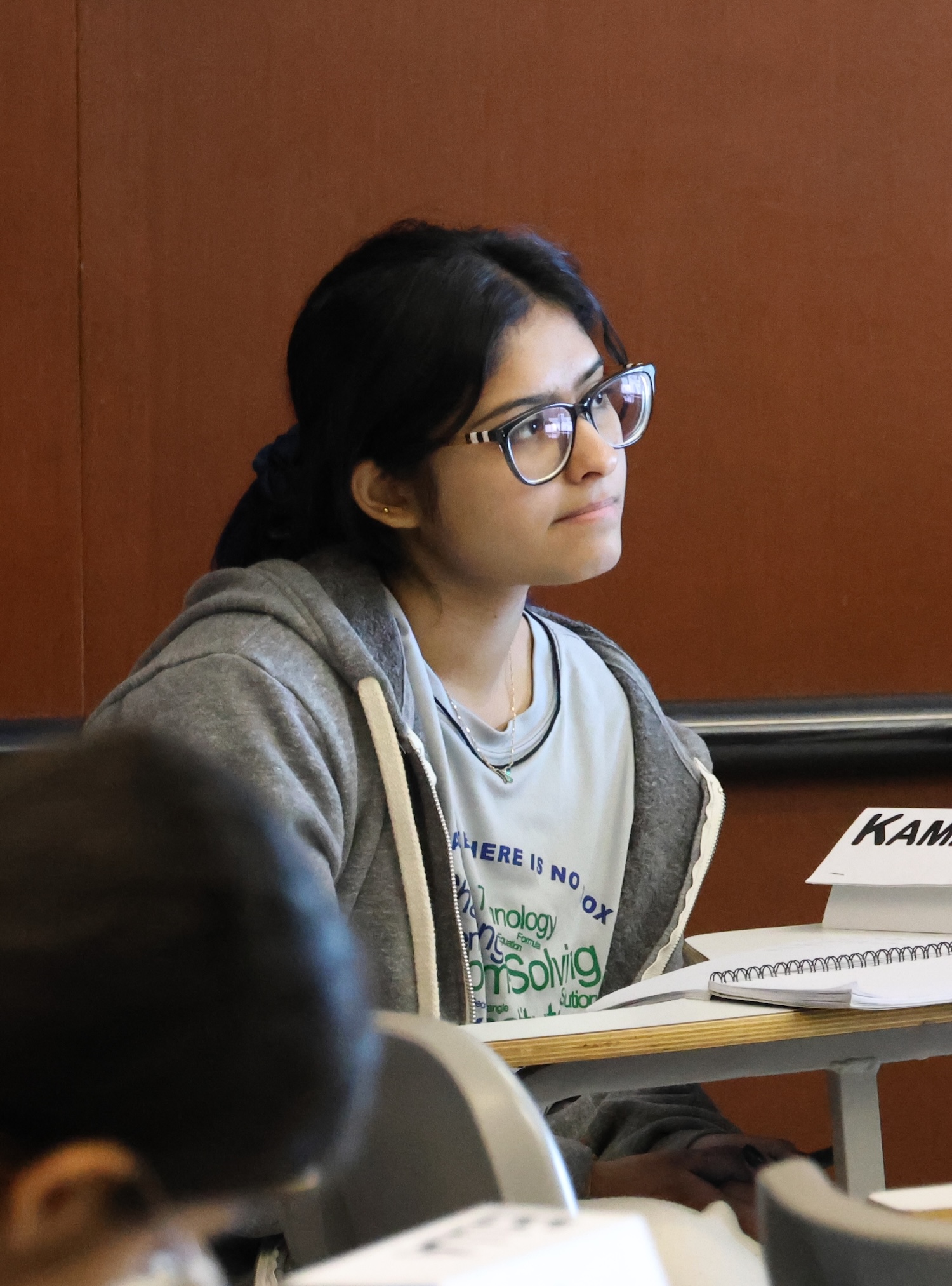 An ICPS participant sitting in class