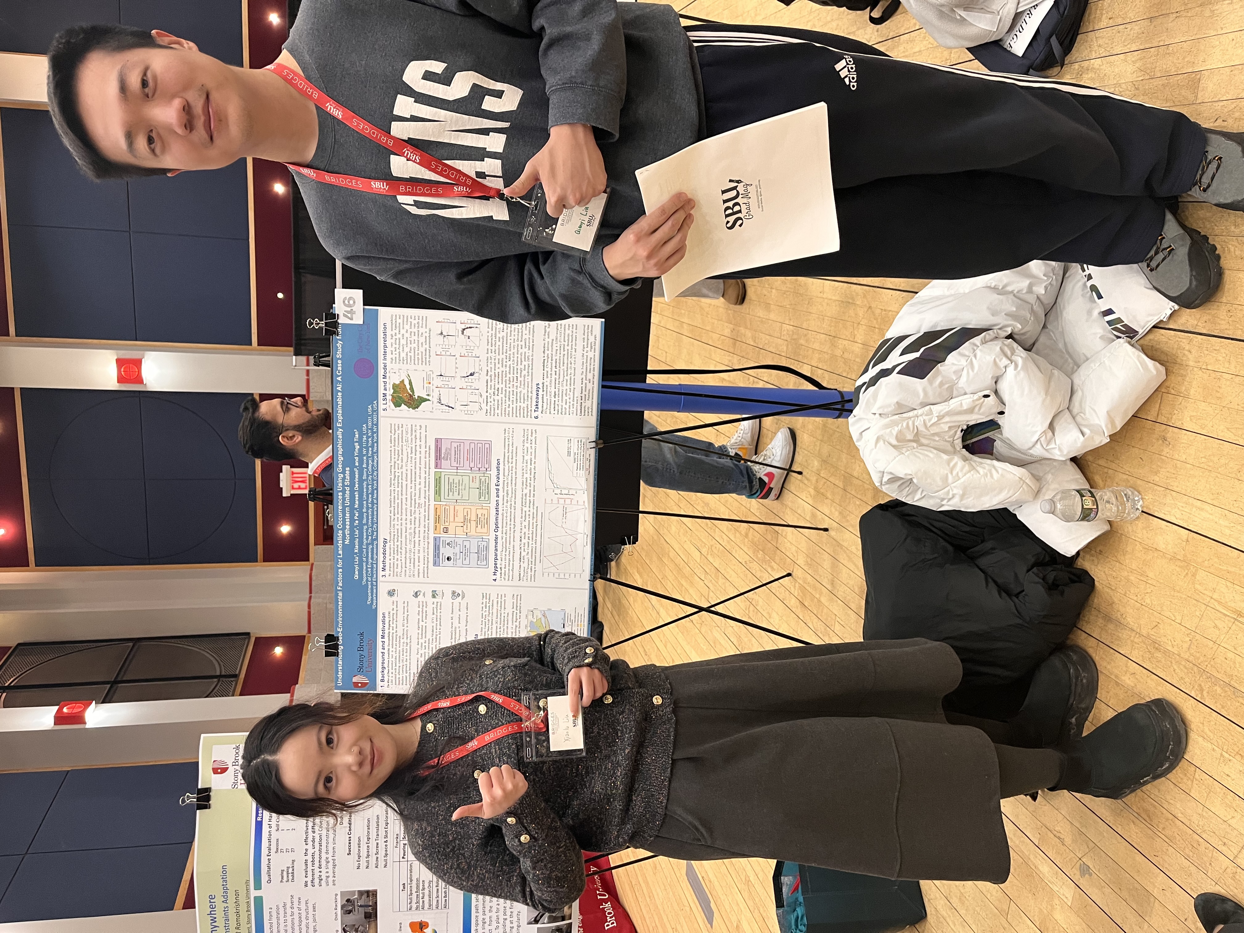 Q. Liu and X. Liu with poster